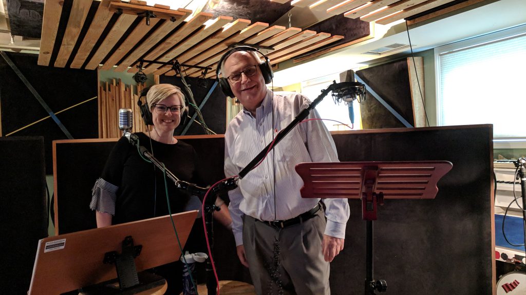 John Cook and Mary Emily Wood prepare in the podcast studio to record an episode of The Patient Experience.