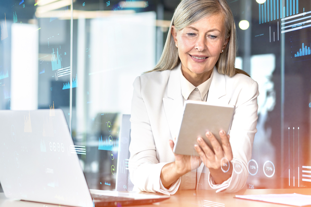 woman looking at tablet